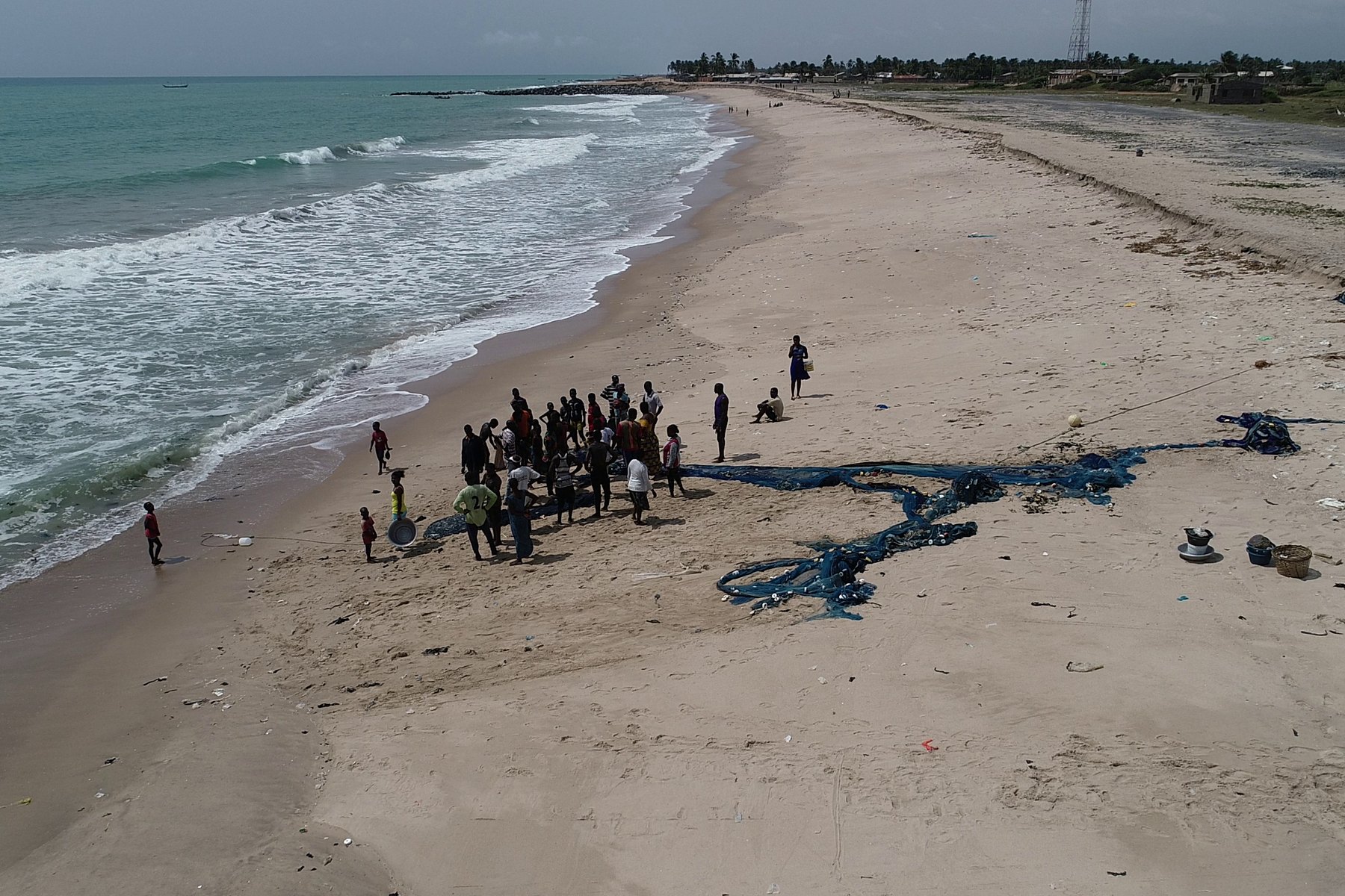 Fishermen hauling a net on the Ghanaian coast